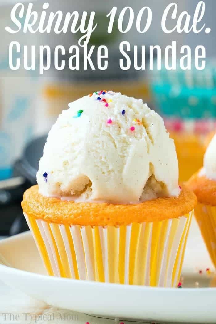 A vanilla cupcake made with cake mix and soda, topped with a scoop of vanilla ice cream, and sprinkled with colorful dots of candy. The text at the top of the image reads, "Skinny 100 Cal. Cupcake Sundae," suggesting it's a low-calorie dessert.