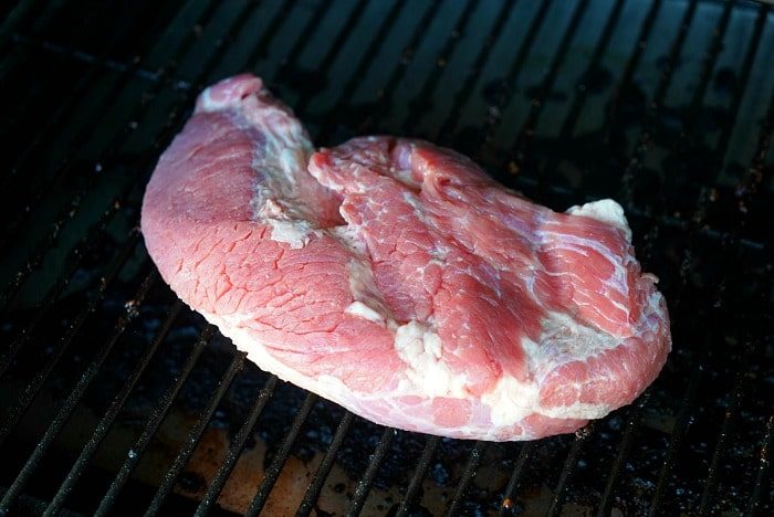 A juicy corned beef brisket sizzles on the grill, ready to transform into a good masterpiece.