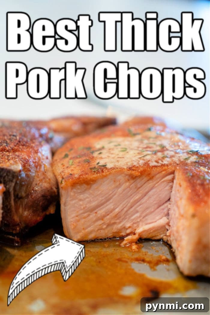 Two perfectly cooked 2-inch thick pork chops on a rustic serving board, ready to be enjoyed