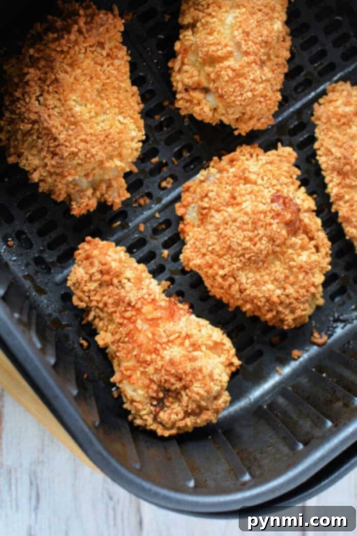 Crispy air fryer gluten free chicken wings in a black air fryer basket