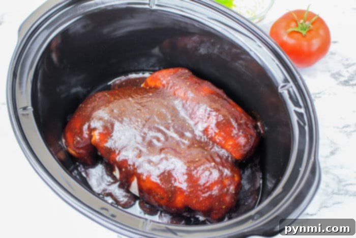 From Freezer to Feast: Slow Cooker Chicken Breasts 4 Slow Cooked Frozen Chicken Breast ready to be served, showcasing its tender texture.