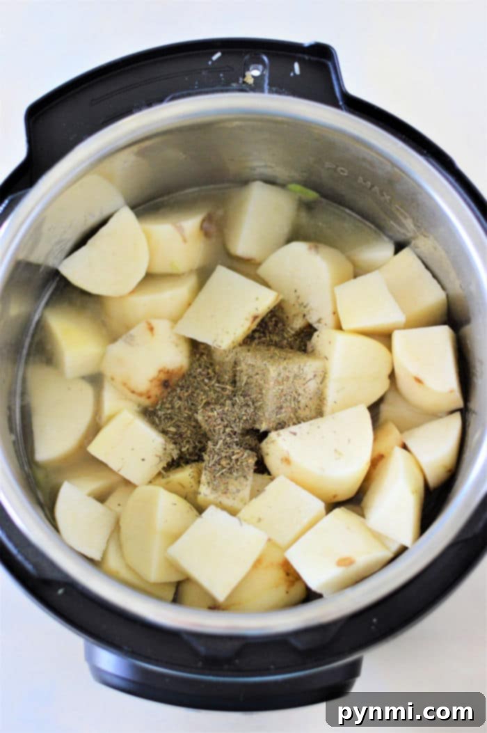 Velvety Instant Pot Potato Leek Comfort 6 Diced potatoes in an Instant Pot, ready for pressure cooking, creating a savory instant pot potato soup.