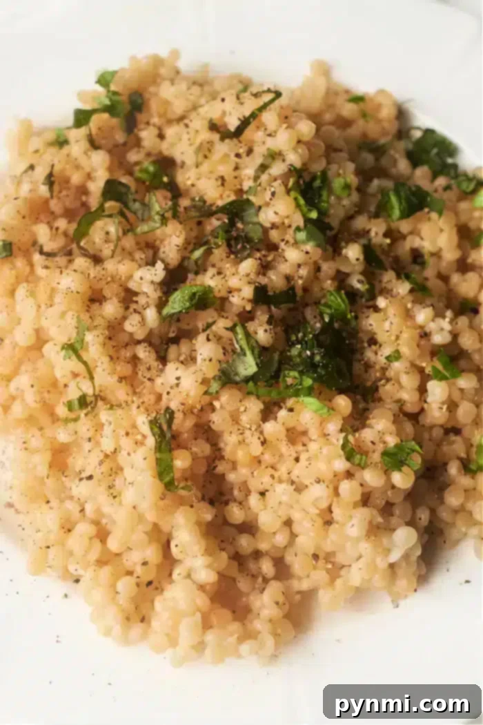 Perfect Pearl Couscous Every Time 6 Instant Pot Pearl Couscous cooked and ready to be fluffed, emphasizing the efficiency of pressure cooking.