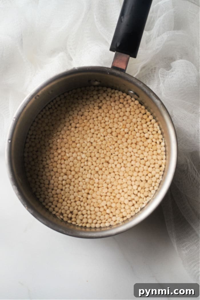 Perfect Pearl Couscous Every Time 8 A bowl of freshly cooked pearl couscous pearls, perfectly separated and ready for customization.