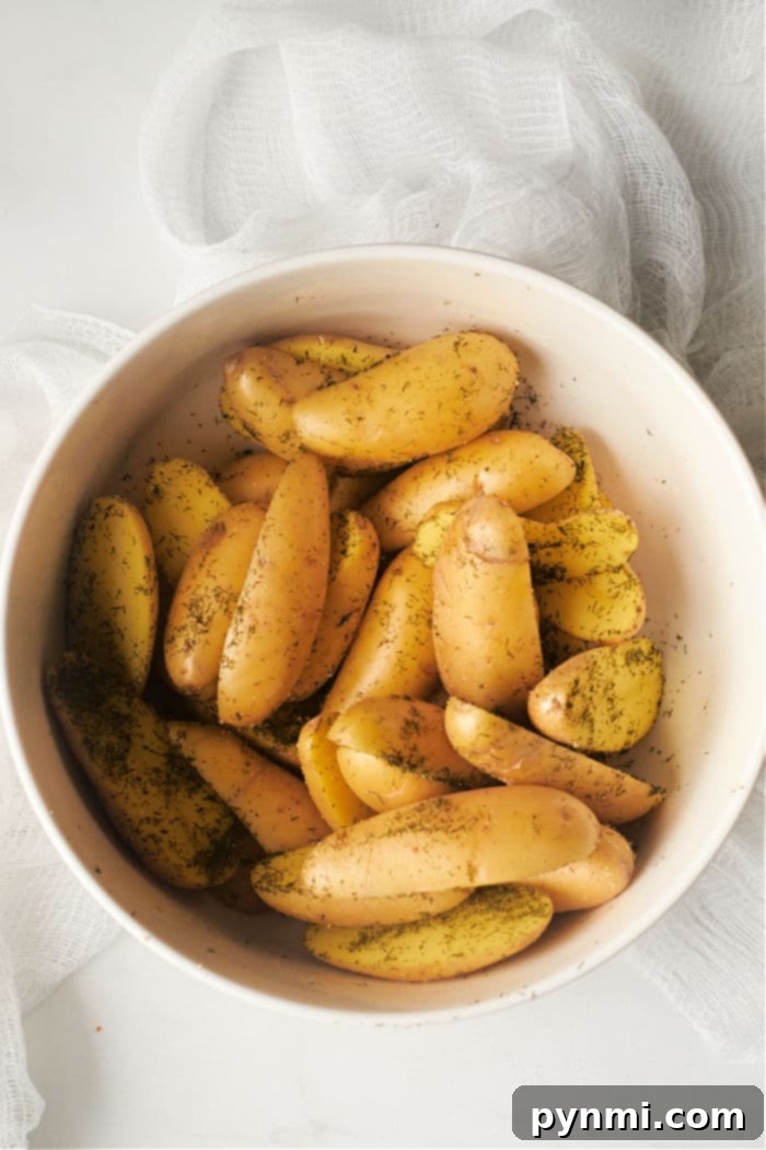 Crispy Air Fryer Fingerling Potatoes 4 Air frying fingerling potatoes with fresh herbs