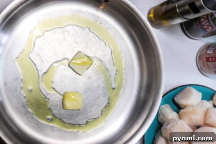 Cooking Frozen Scallops to Perfection 4 Frozen scallops sizzling in a hot pan, starting to develop a beautiful sear.