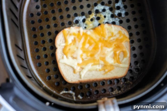 Teenager making toast in an air fryer