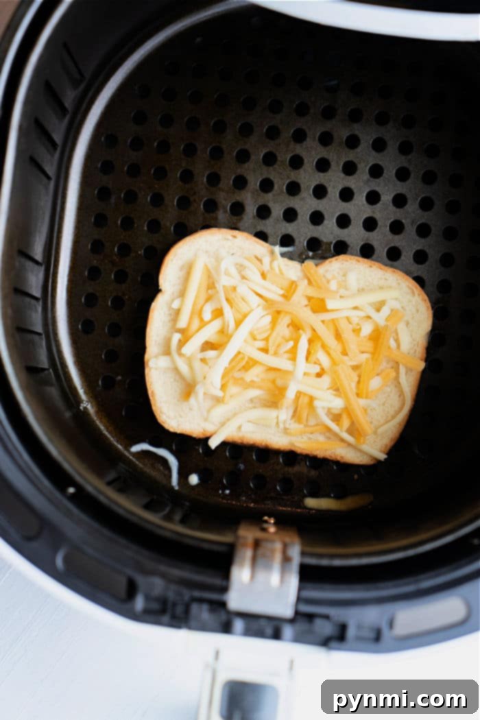 Crispy Air-Fried Tuna Sandwich 10 Crispy, golden-brown cheese toast in an air fryer, with bubbly melted cheese, forming the ideal foundation for an open-faced tuna melt sandwich.
