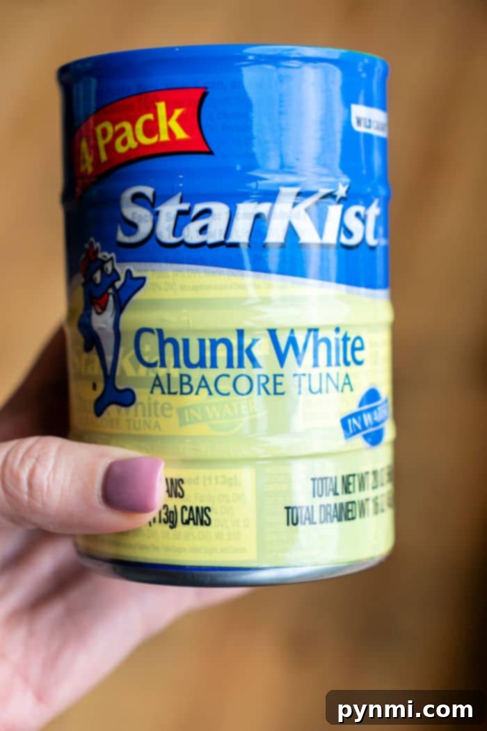 Crispy Air-Fried Tuna Sandwich 3 A high-quality can of solid white albacore tuna, prominently displayed, emphasizing the ideal choice for a rich and flavorful tuna melt filling.