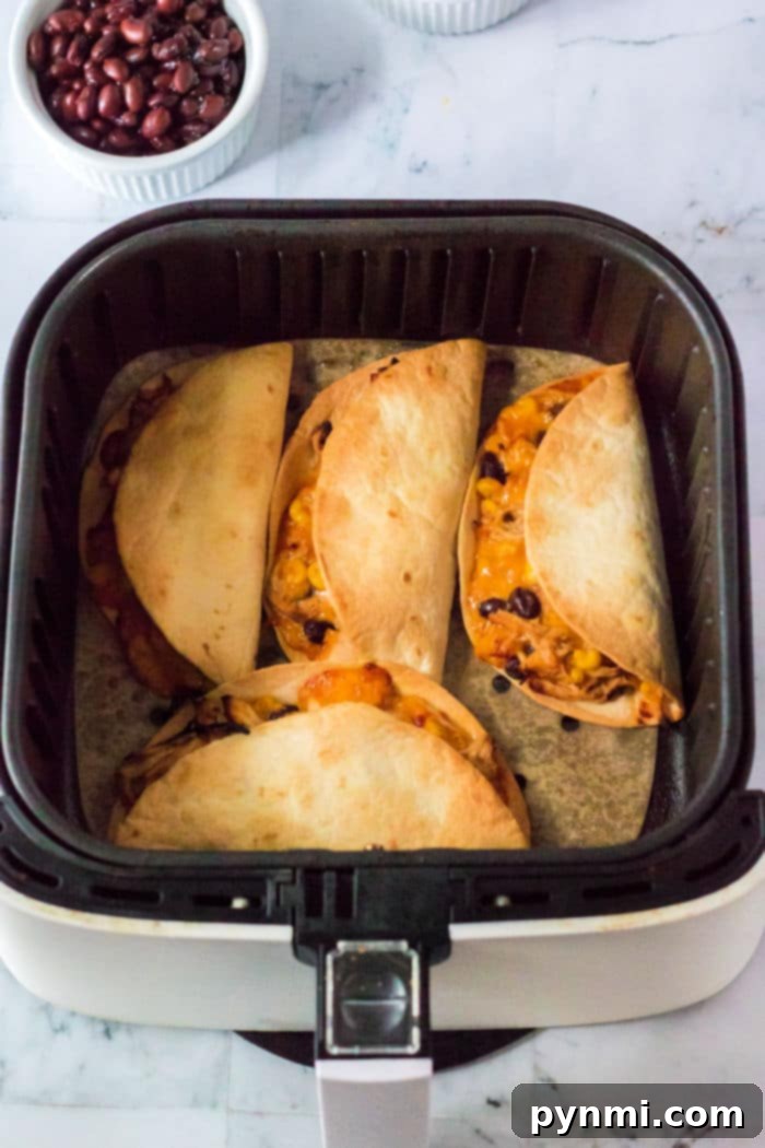 Air Fryer chicken Tacos, golden and crispy, filled with savory chicken.