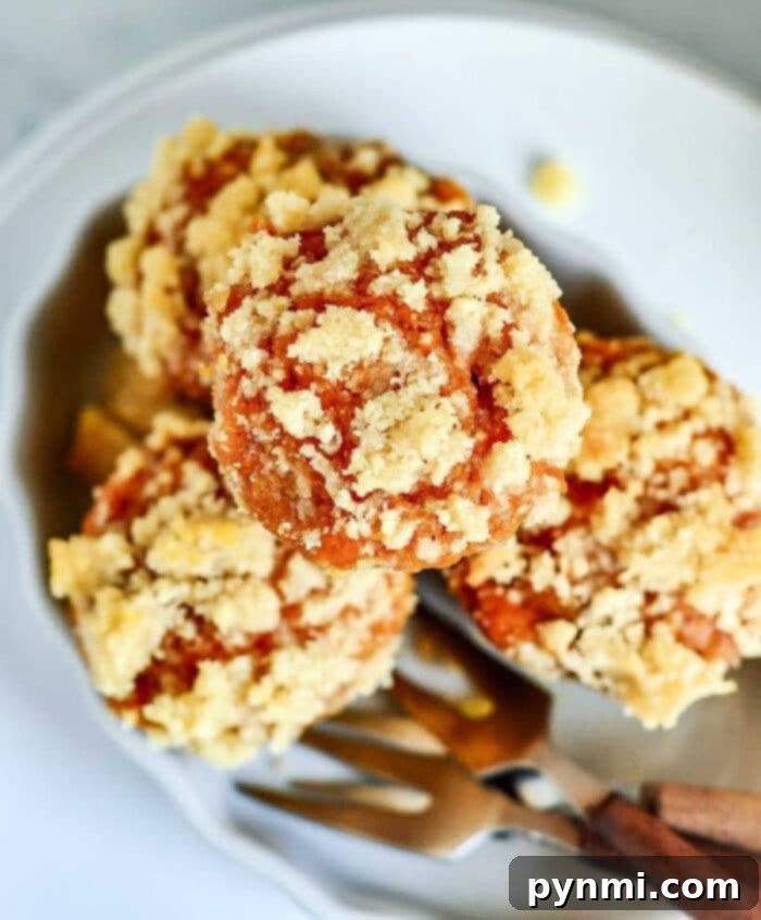 Pumpkin Mini Muffins with streusel topping, baked to a golden brown perfection.