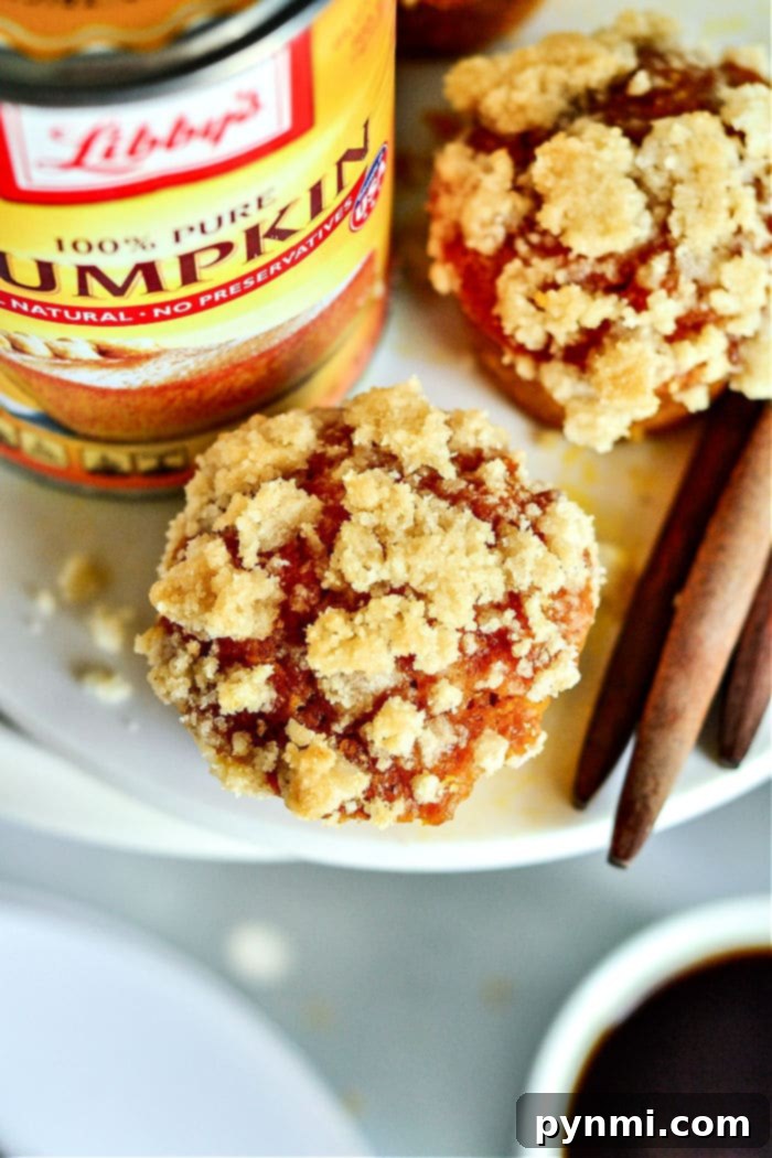 Perfectly baked Libby's Pumpkin Muffins on a cooling rack, showcasing their golden-brown tops and moist interior, ready to be enjoyed.