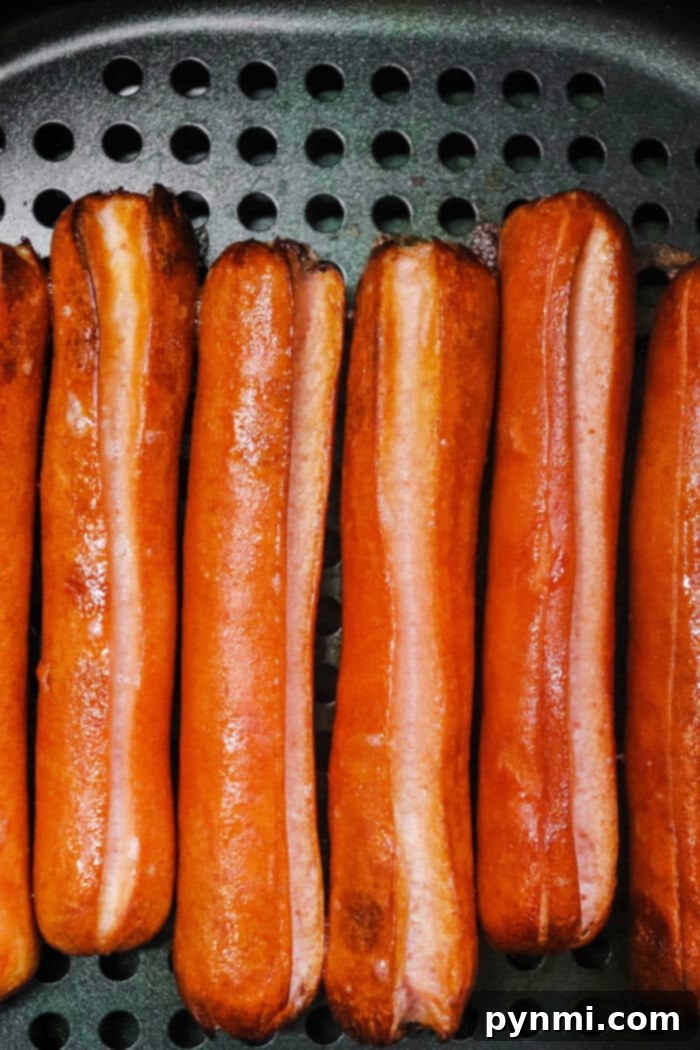 Steps for cooking frozen hot dogs in an air fryer.