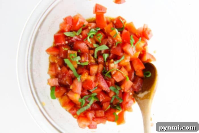 An assortment of bruschetta toppings, including fresh tomatoes, basil, and other gourmet options.