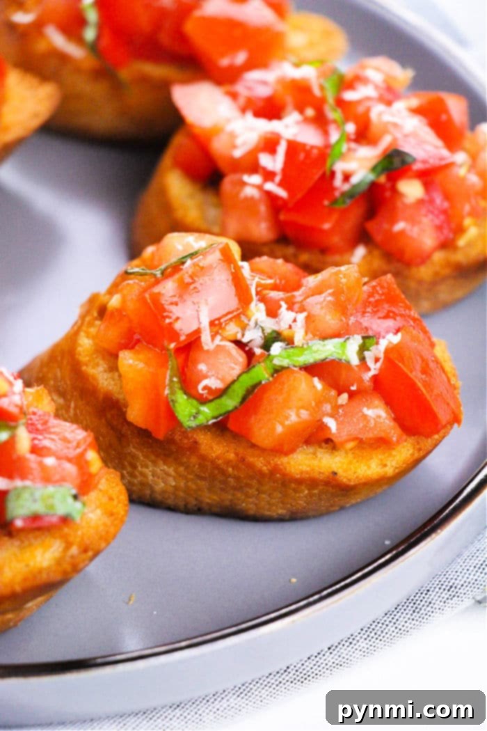 Classic Bruschetta with Mozzarella and a vibrant tomato-basil topping on a wooden board.