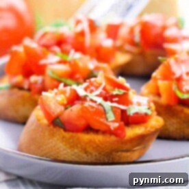 Learn how to make Bruschetta Toast with diced tomatoes and fresh basil, elegantly served on a plate.