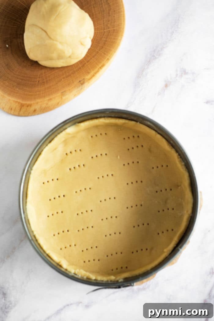 3 Ingredient Pie Crust - dough being pressed into a pan