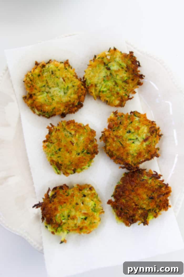 Crispy Zucchini Fritters with a Dollop of Sour Cream