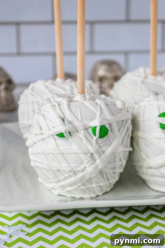 Ghostly White Chocolate Candy Apples 2 Halloween Candy Apples decorated like mummies with white chocolate and edible eyes