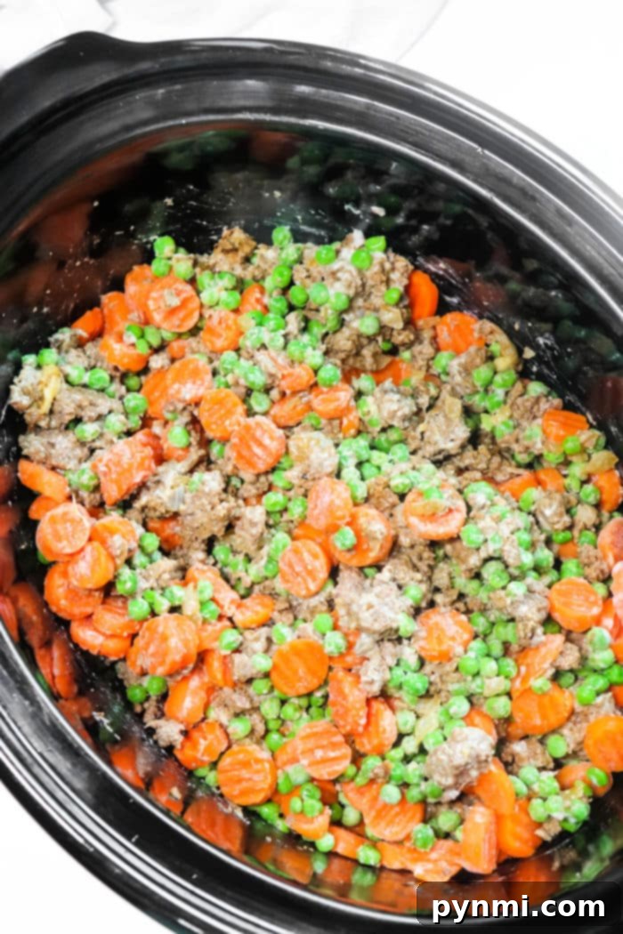 Slow Cooker Comfort Shepherd's Pie 9 Crockpot Shepherd's Pie served in a bowl, showing layers.