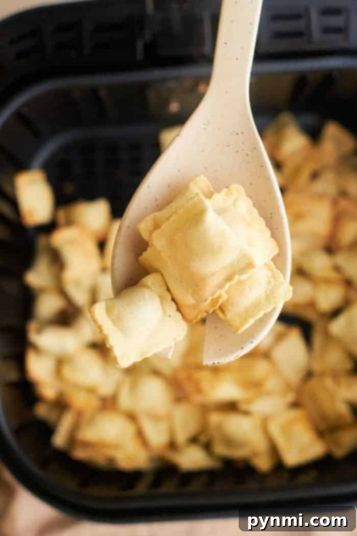 Crispy Frozen Ravioli cooked in an air fryer, golden brown and ready to serve