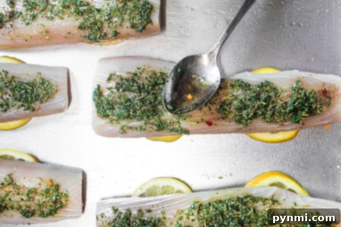 Optimal Bake Time for Mahi Mahi 4 Raw mahi mahi fillets on lemon slices with herbs and seasonings