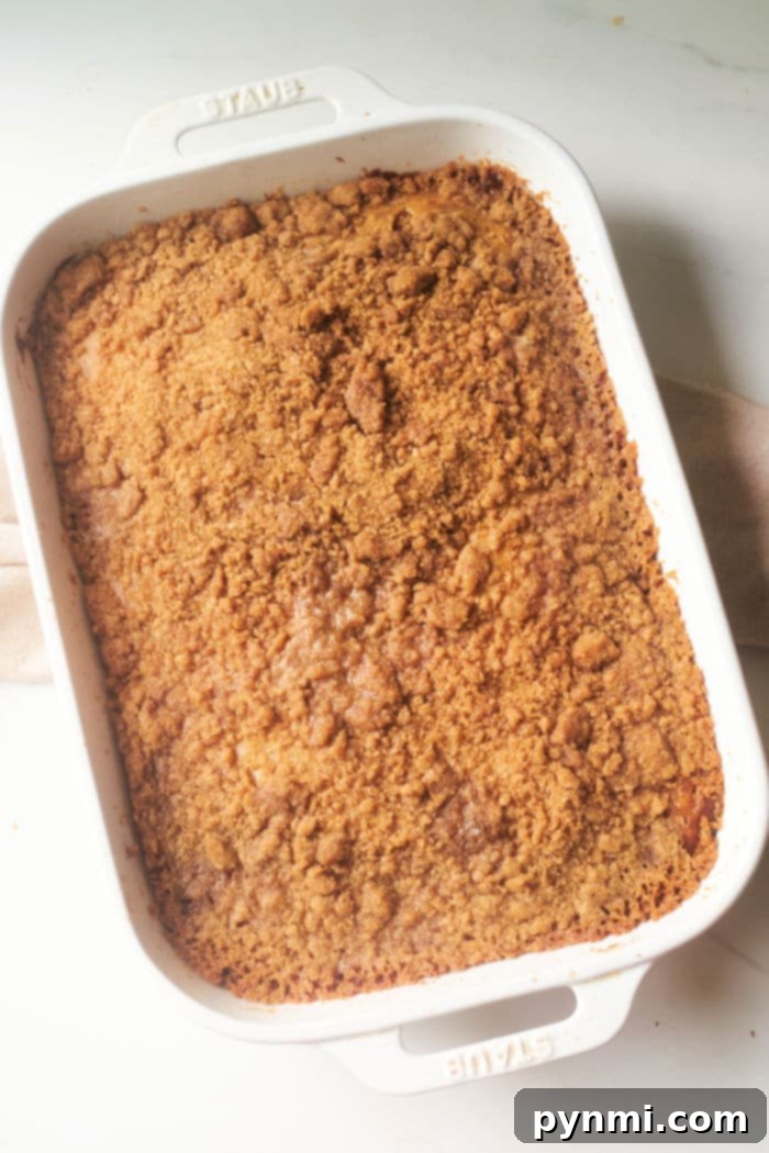 Ultimate Banana Streusel Coffee Cake 2 Deliciously moist banana coffee cake with a generous streusel topping, ready to be served.