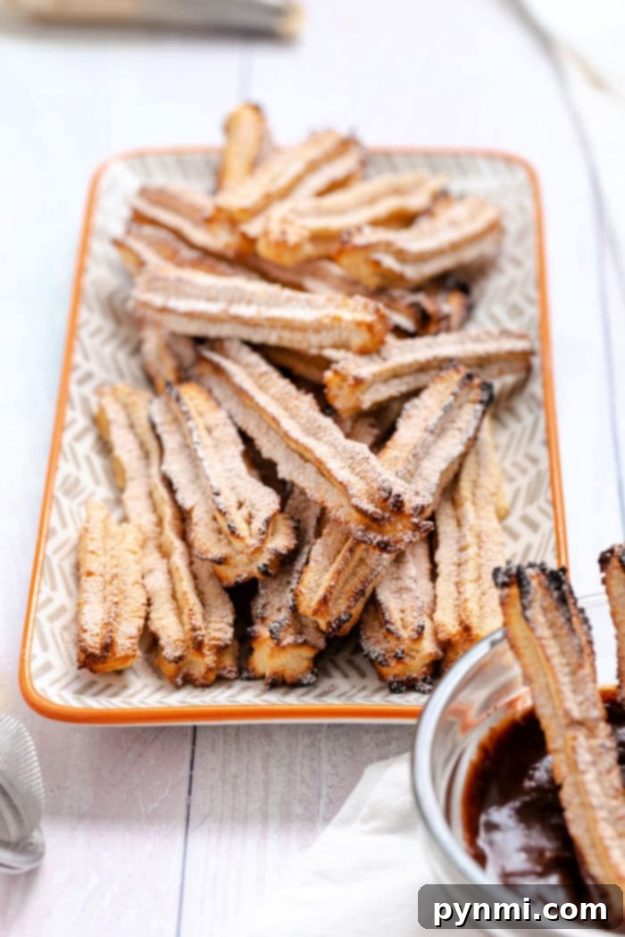 Crispy golden churros filled with melted chocolate, ready to be enjoyed.