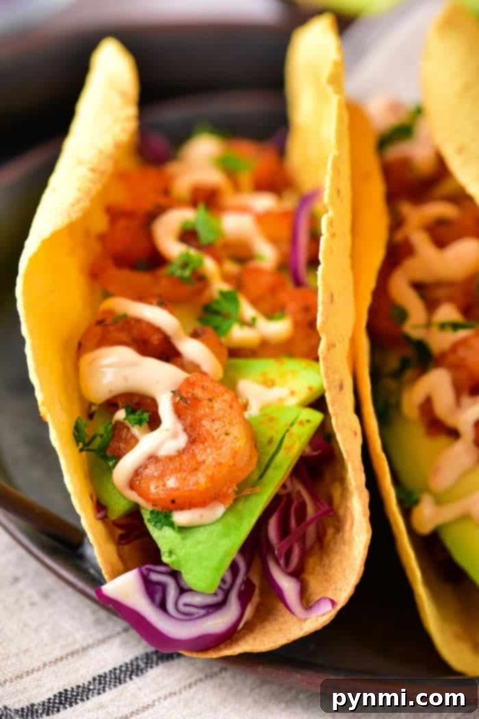 How to Make Shrimp Tacos with Frozen Cooked Shrimp - A close-up of delicious shrimp tacos ready to be served.
