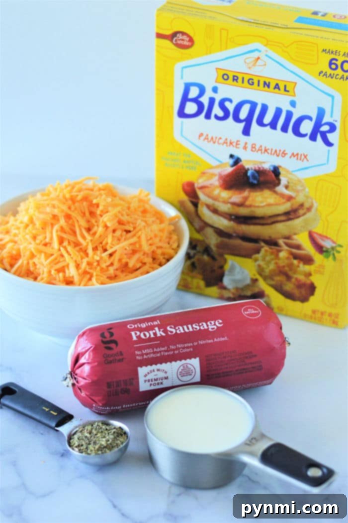 3 Ingredient Bisquick Sausage Balls on a white plate with a blurred background.