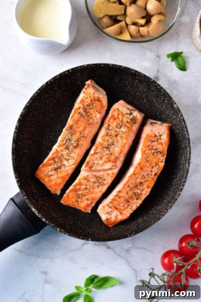 Mastering Sockeye A Guide to Delicious Salmon 4 Sockeye salmon fillets searing in a hot pan, demonstrating the pan-cooking method.