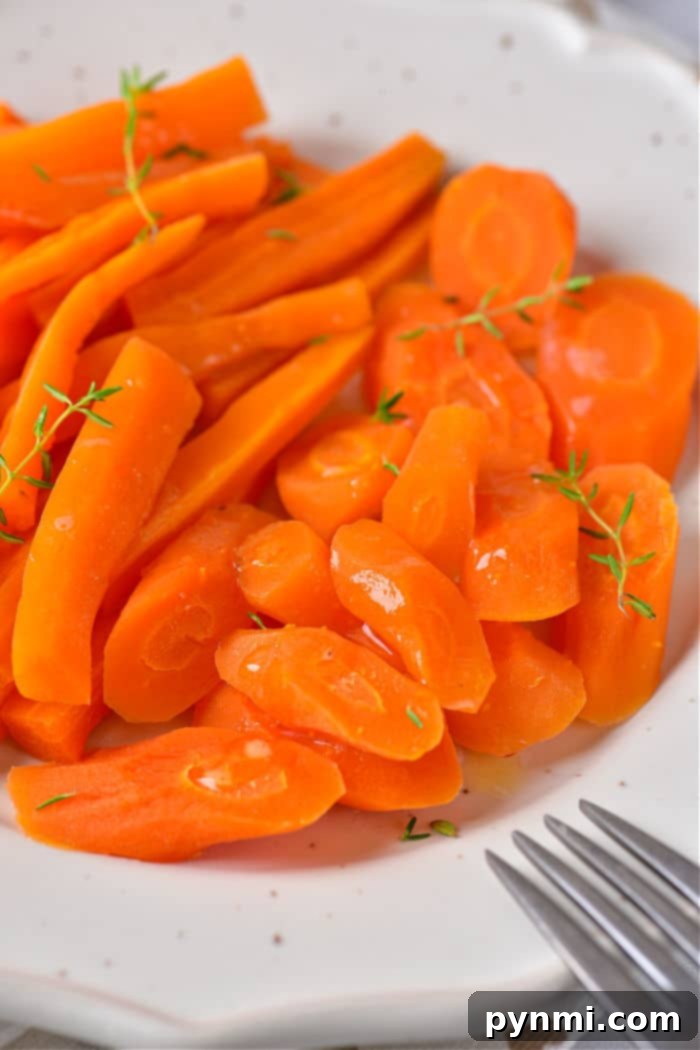 Effortless Microwave Carrots 2 Cook Carrots in Microwave: A plate of perfectly cooked, tender carrots, ready to be served as a healthy side dish.