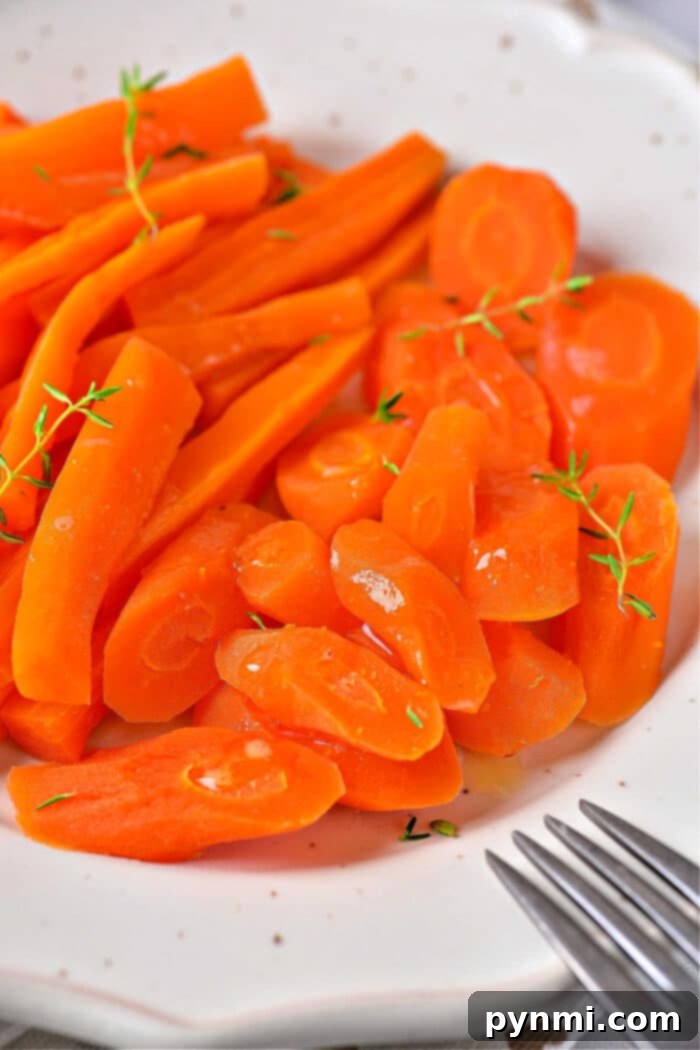 Effortless Microwave Carrots 8 Cook Carrots in Microwave: A vibrant bowl of seasoned microwaved carrots, showcasing a healthy and easy-to-prepare dish.
