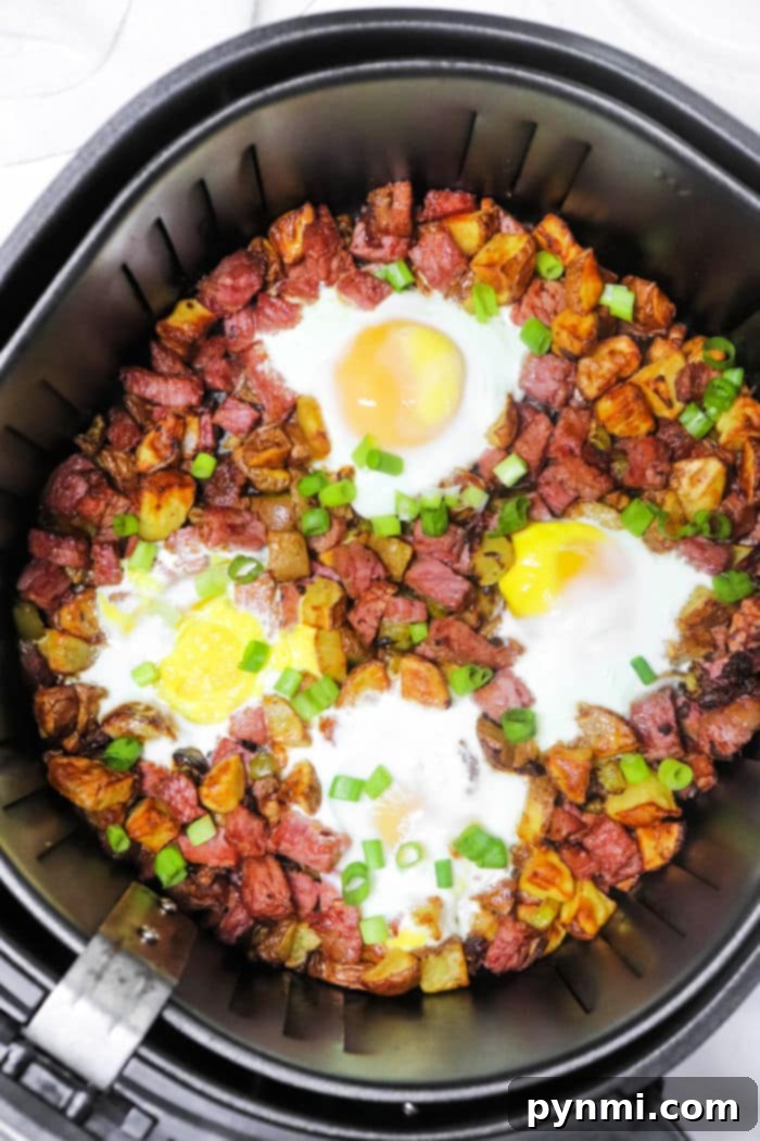 Crispy Air Fryer Corned Beef Hash 2 Crispy Air Fryer Corned Beef Hash with golden potatoes and savory corned beef chunks, perfect for breakfast or brunch.