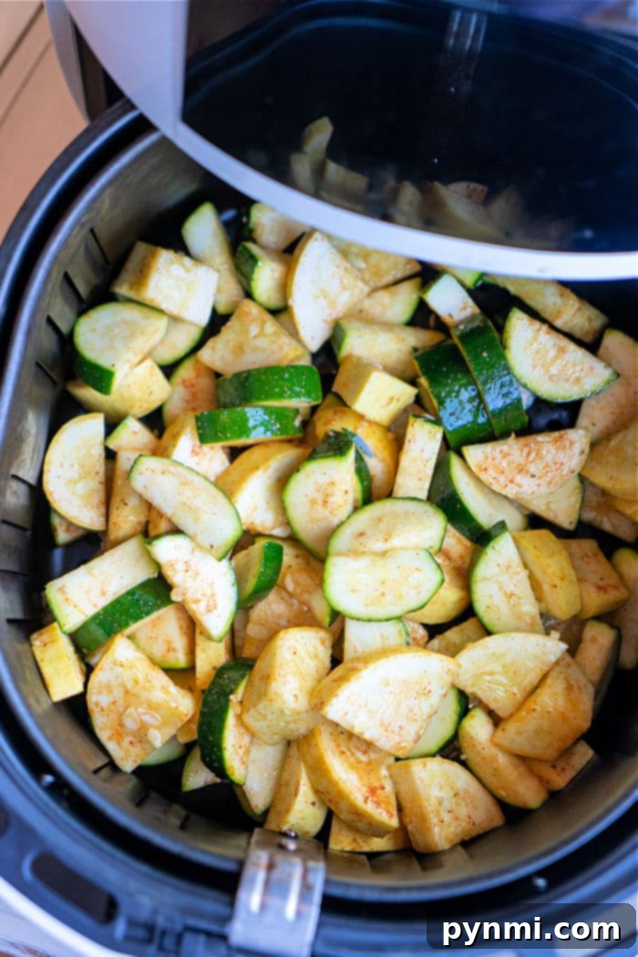 Air Fryer Zucchini and Squash filling the basket, ready for cooking