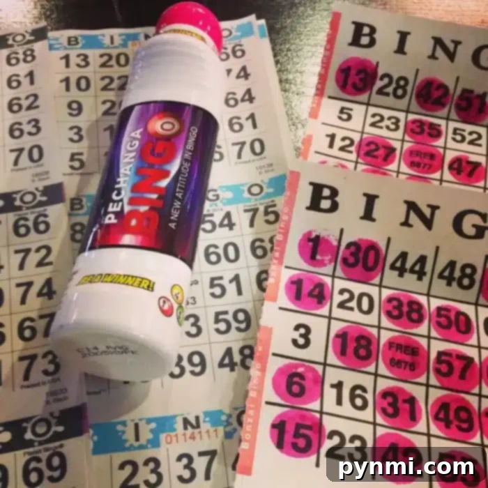 Rows of pink-marked numbers stretch across the bingo cards, while a "Pechanga Bingo" dauber rests on top, ready for action.