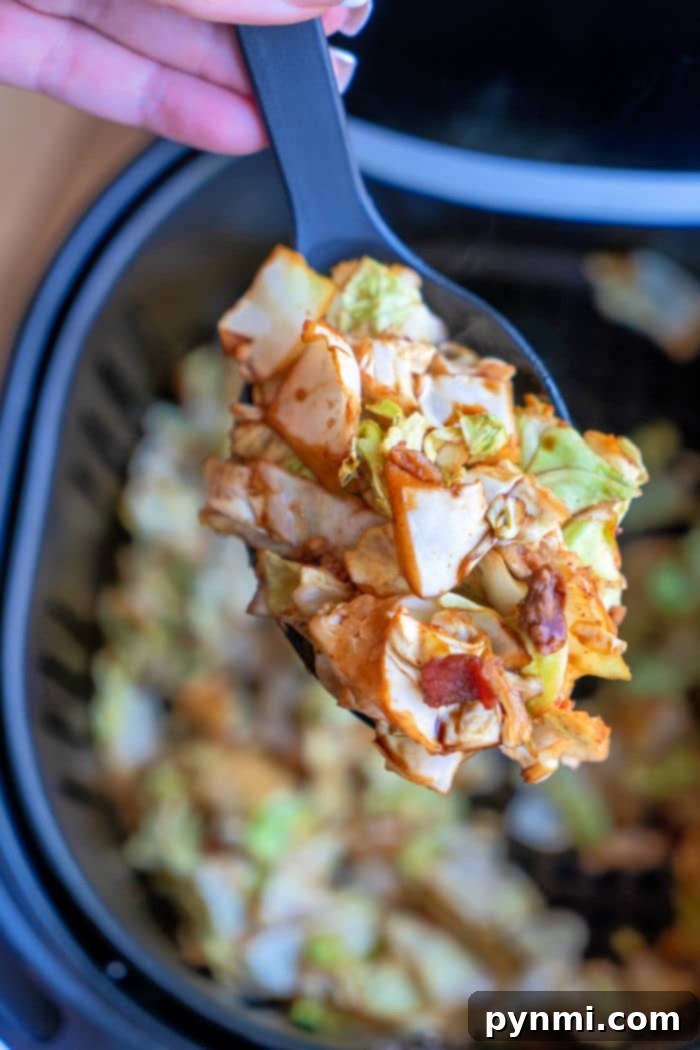 Crispy Air Fryer Cabbage 2 Fried Cabbage in Air Fryer: A golden-brown serving of crispy cabbage with bacon bits, perfectly cooked in an air fryer.