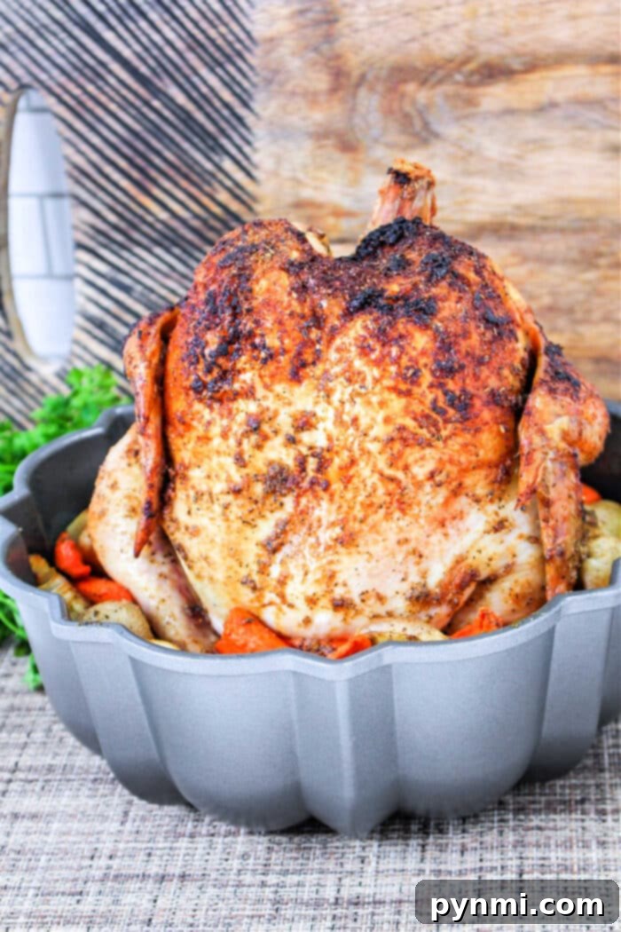 Crispy Oven Rotisserie Chicken 7 Finished rotisserie chicken in oven served with roasted vegetables