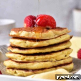 Learn how to make a pancake stack that's irresistible—fluffy pancakes topped with juicy strawberries and a spoonful of syrup cascading down in sweet harmony.