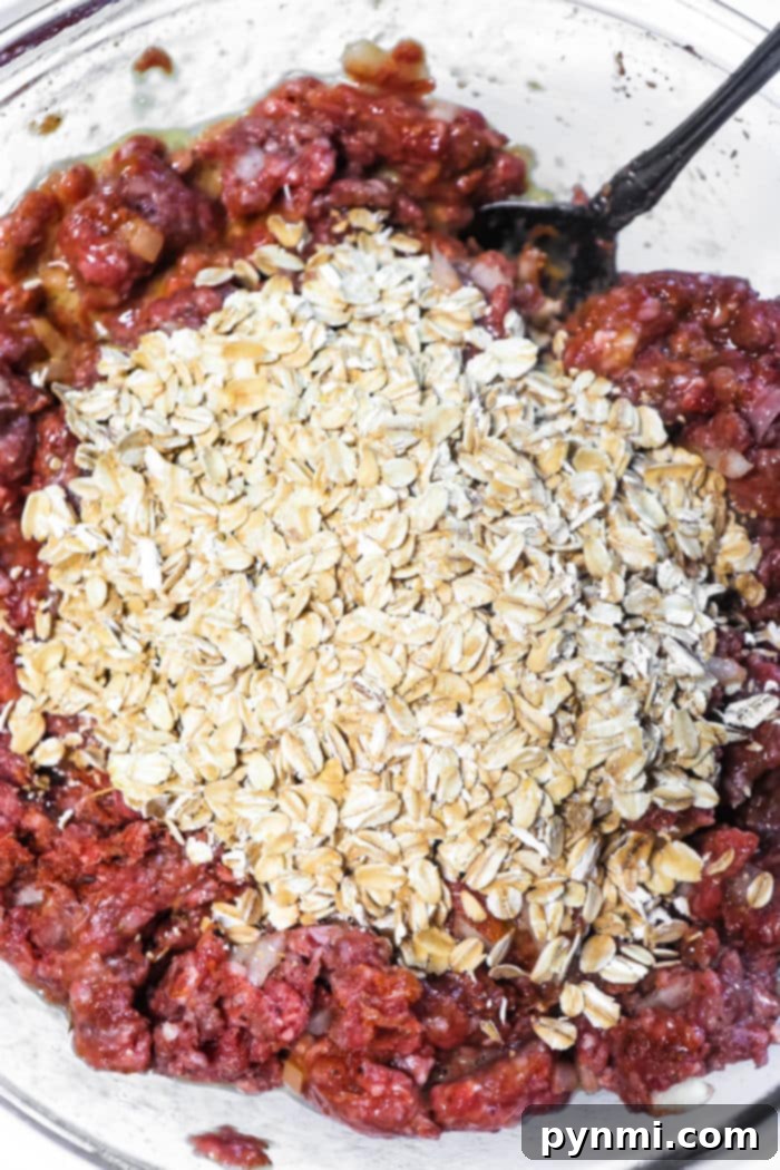 Juicy Meatloaf Without Breadcrumbs 4 Close-up of a rustic meatloaf made with oats, showcasing its rich texture and savory crust.
