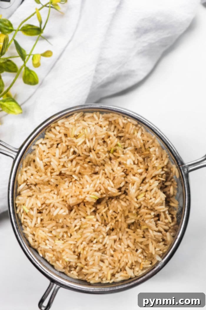 Effortless Slow Cooker Brown Rice Perfection 5 Close-up of slow-cooked brown rice in a Crockpot, highlighting its perfectly cooked grains.