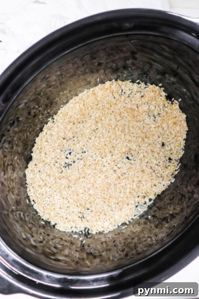 Effortless Slow Cooker Brown Rice Perfection 6 Slow cooker with brown rice and beans, ready to be served.
