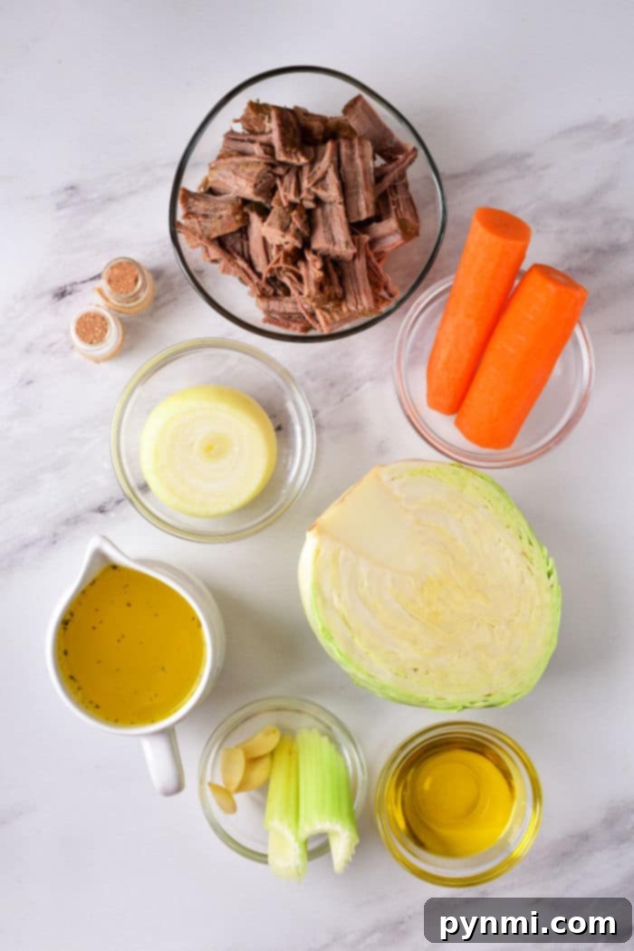 Comforting Cabbage Stew 3 On a rustic wooden surface, a collection of fresh ingredients for a healthy cabbage stew includes shredded beef, vibrant carrots, sliced onion, crisp cabbage wedges, savory broth, minced garlic, chopped celery, glistening olive oil, and an assortment of aromatic spices.
