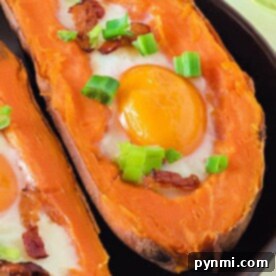 Effortless Pressure Cooker Sweet Potatoes 6 Pressure Cooker Sweet Potatoes with eggs, crispy bacon, and chopped green onions on top, served on a sleek black plate.