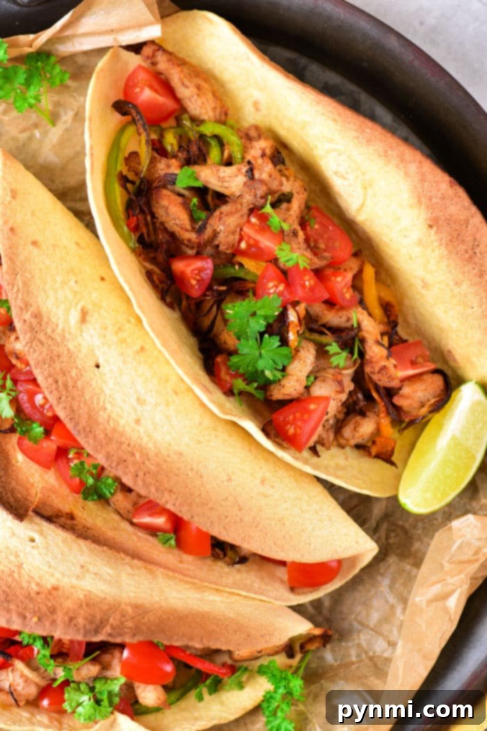 Sizzling Chicken Fajita Wraps 7 Chicken Fajita Tacos - A vibrant plate of chicken fajita tacos with fresh toppings.