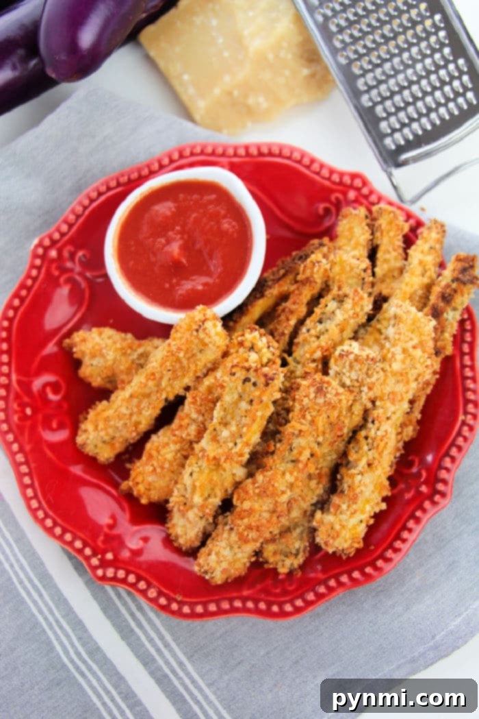 Golden Crispy Air Fryer Eggplant 6 Eggplant French Fries, golden and perfectly seasoned, ready to be dipped and enjoyed.