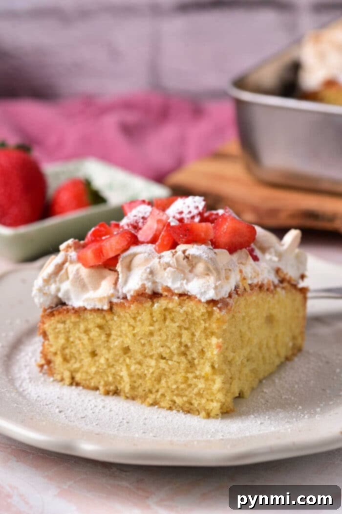 Luscious Strawberry Shortcake crowned with fluffy meringue and fresh lemon zest