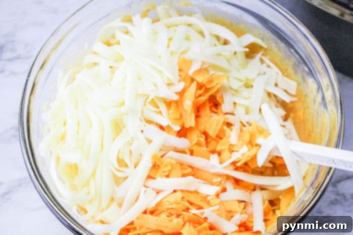 Generous amount of shredded cheese for the ultimate cheesy lasagna