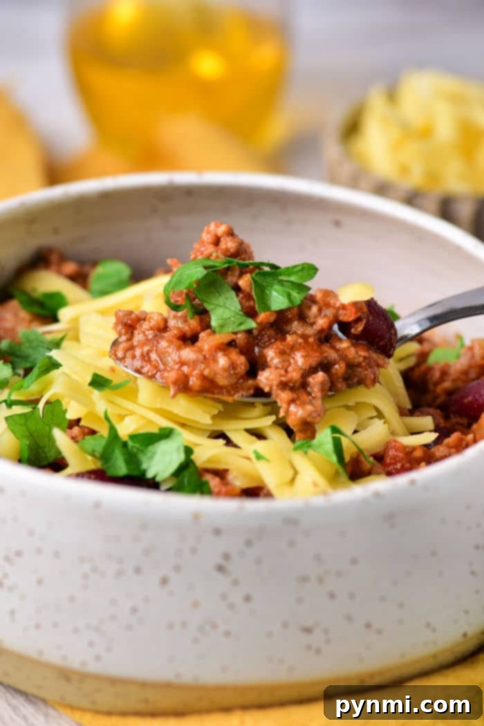 Stovetop Chili simmering in a vibrant Dutch oven, ready to be served.