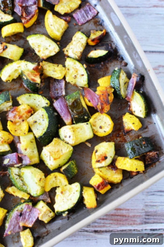 Golden Roasted Zucchini and Squash 5 Finished plate of roasted zucchini and squash with herbs.